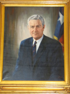John Connally was riding in the car when President Kennedy was assassinated and was wounded (apparently--?--by the same bullet that killed Kennedy).